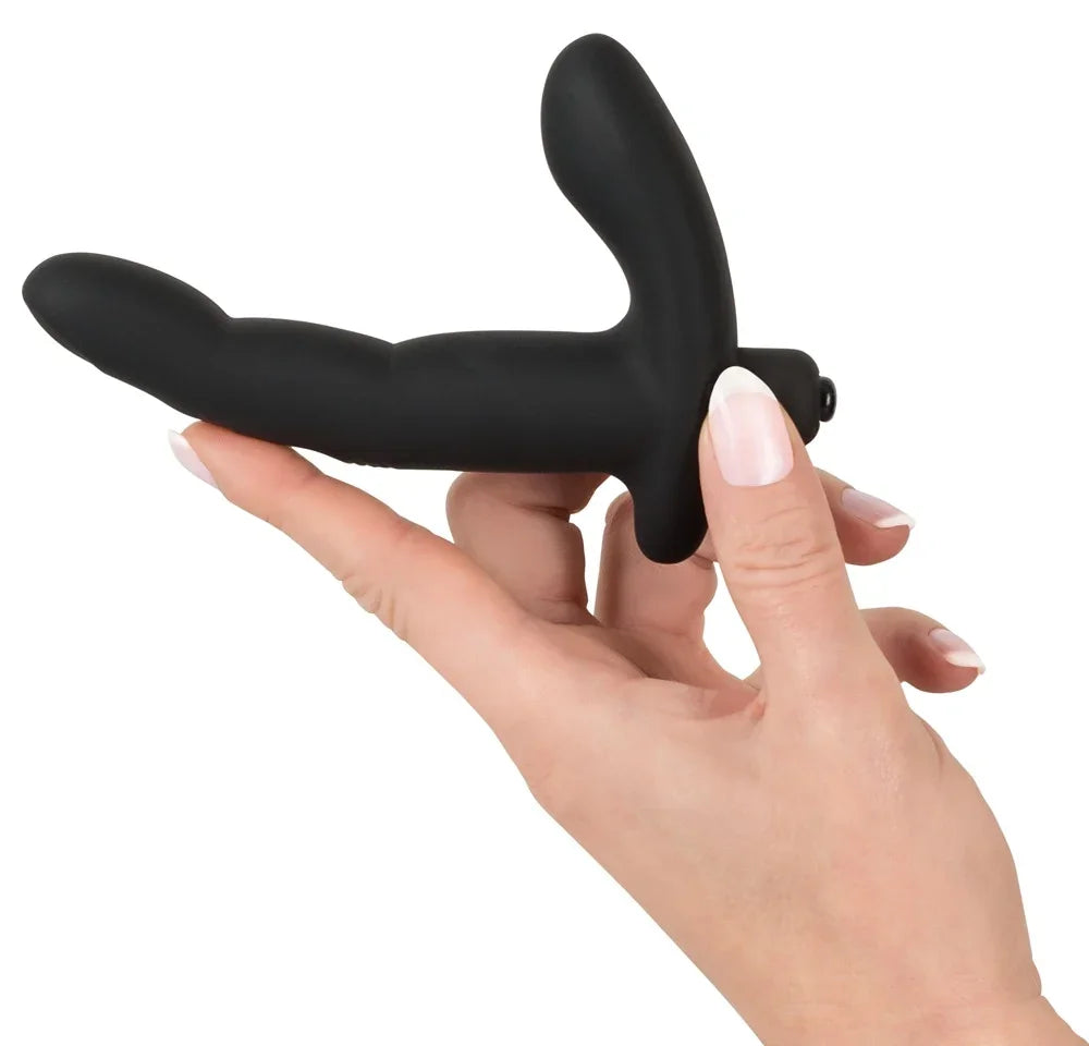 Schwarzer Dildo mit G-Punkt-Stimulation, gehalten in Hand mit gepflegten Nägeln