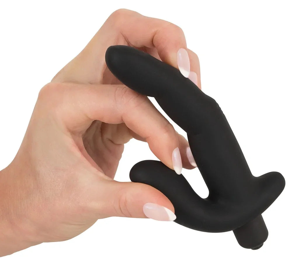 Schwarzer Dildo mit G-Punkt-Stimulation, gehalten in Hand mit gepflegten Nägeln