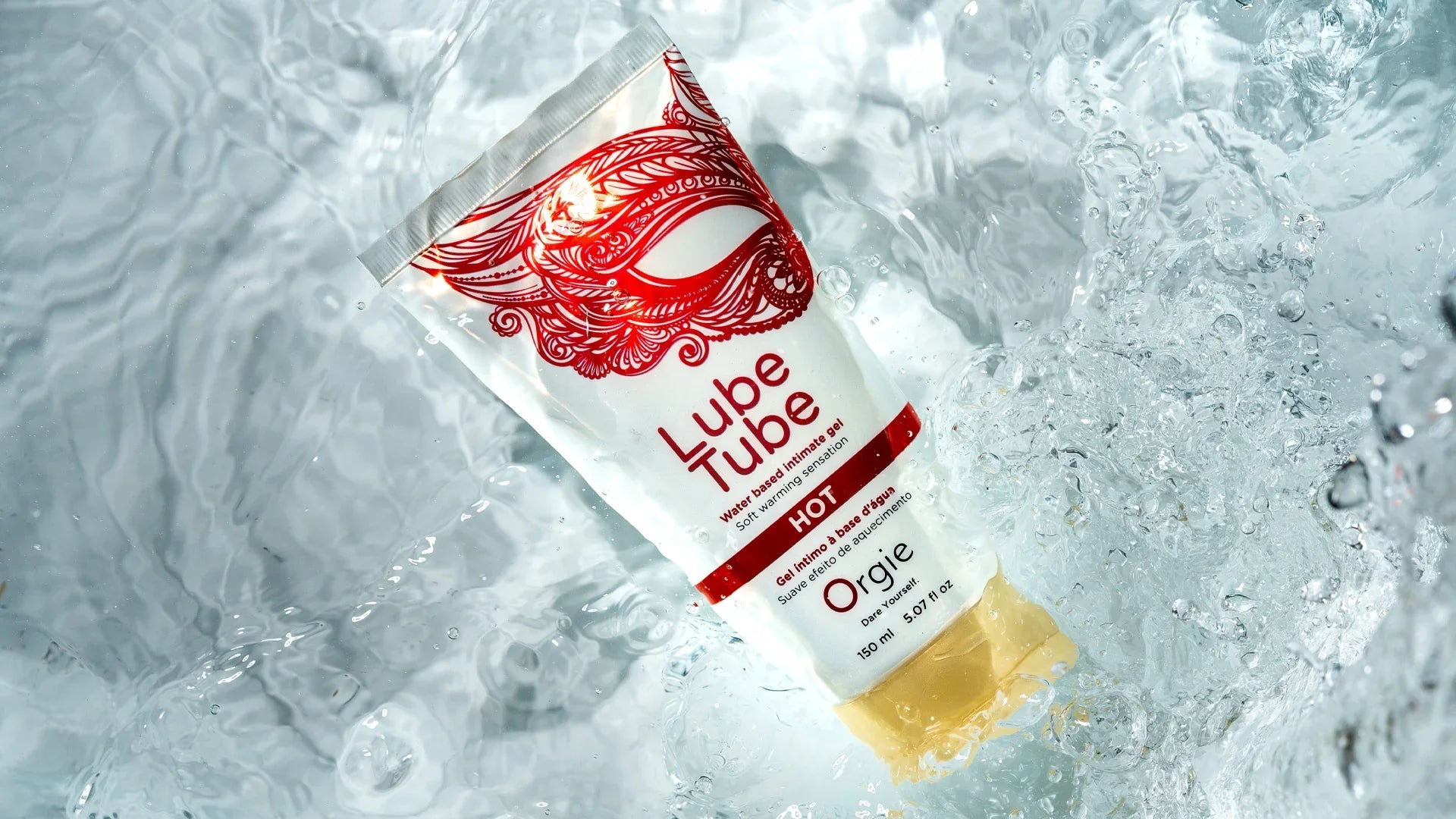 Lube Tube wasserbasiertes Gleitmittel mit rotem Design, schwimmend im Wasser