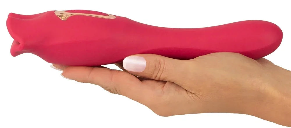 Roter Vibrator in Hand gehalten, ideal für intime Momente und Liebesleben