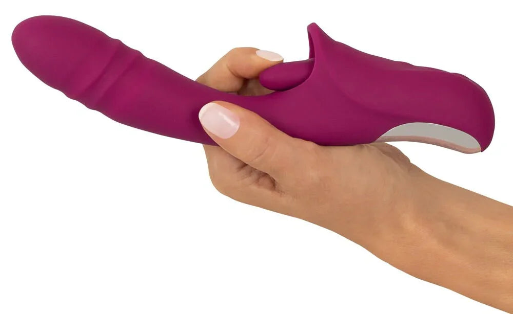 Lila Vibrator mit ergonomischem Design wird in einer Hand gehalten, Sexspielzeug für Erwachsene