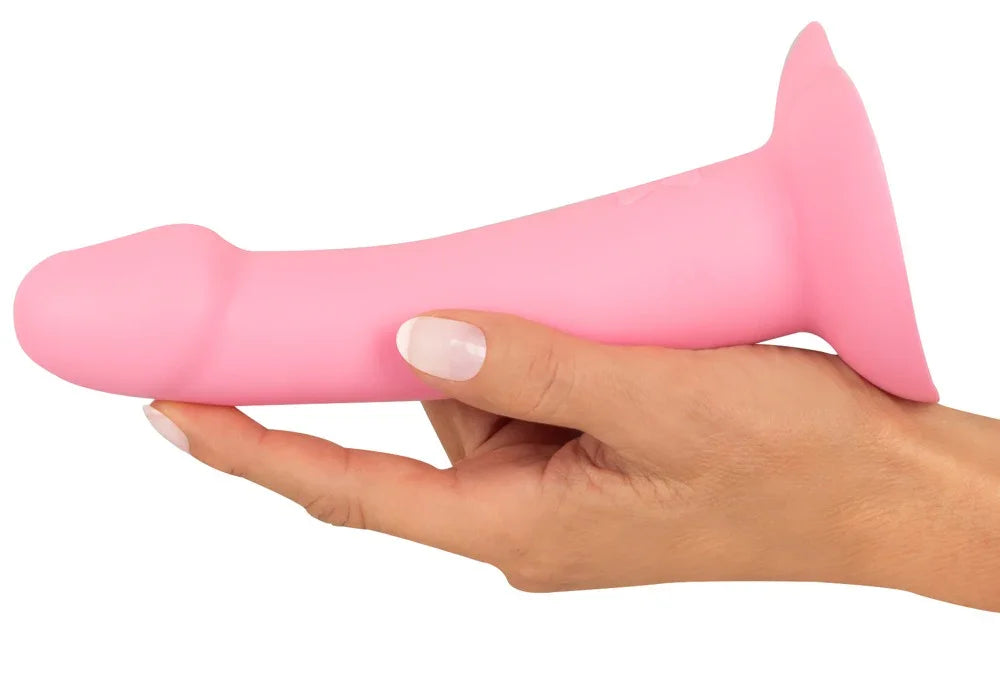 Pinkfarbener Silikon-Dildo mit Saugnapf, gehalten von einer Hand, Sexspielzeug