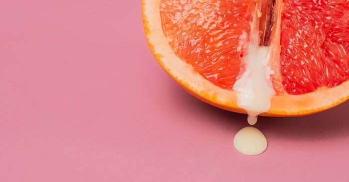 Halbe Grapefruit mit weißem Tropfen, Symbolbild für Gleitgel und Luststeigerung